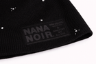 Close-up of BACK HOME black ribbed beanie with silver studs and tonal Nana Noir patch
