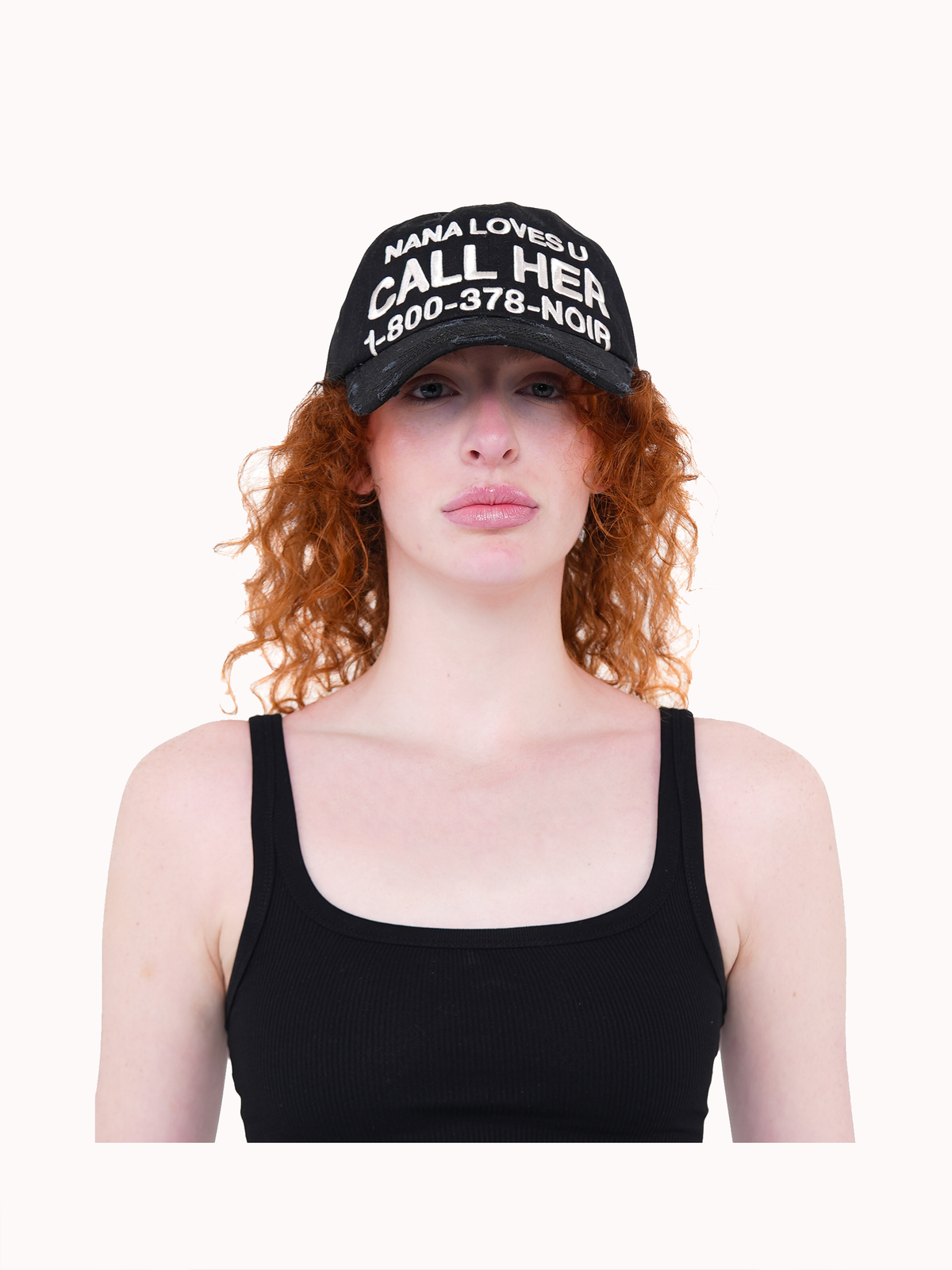 Model wearing the CALL HER distressed black dad cap with white slogan embroidery