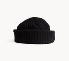 Rear view of CHECK IN black crochet beanie showing the wide folded cuff